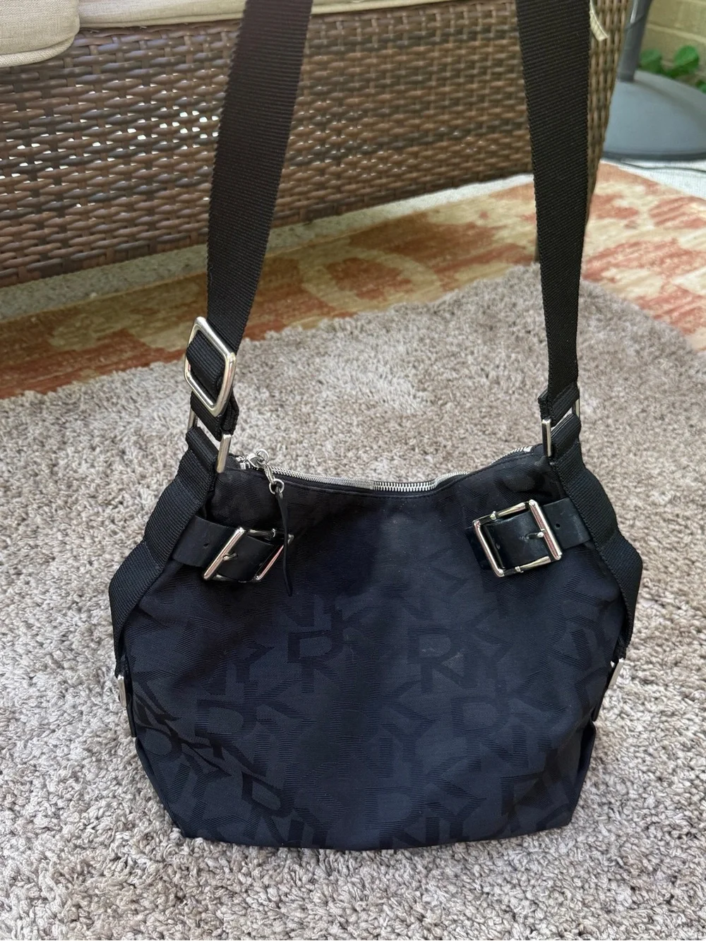 DKNY Black Monogram Messenger Bag with Gold Buckle Accents